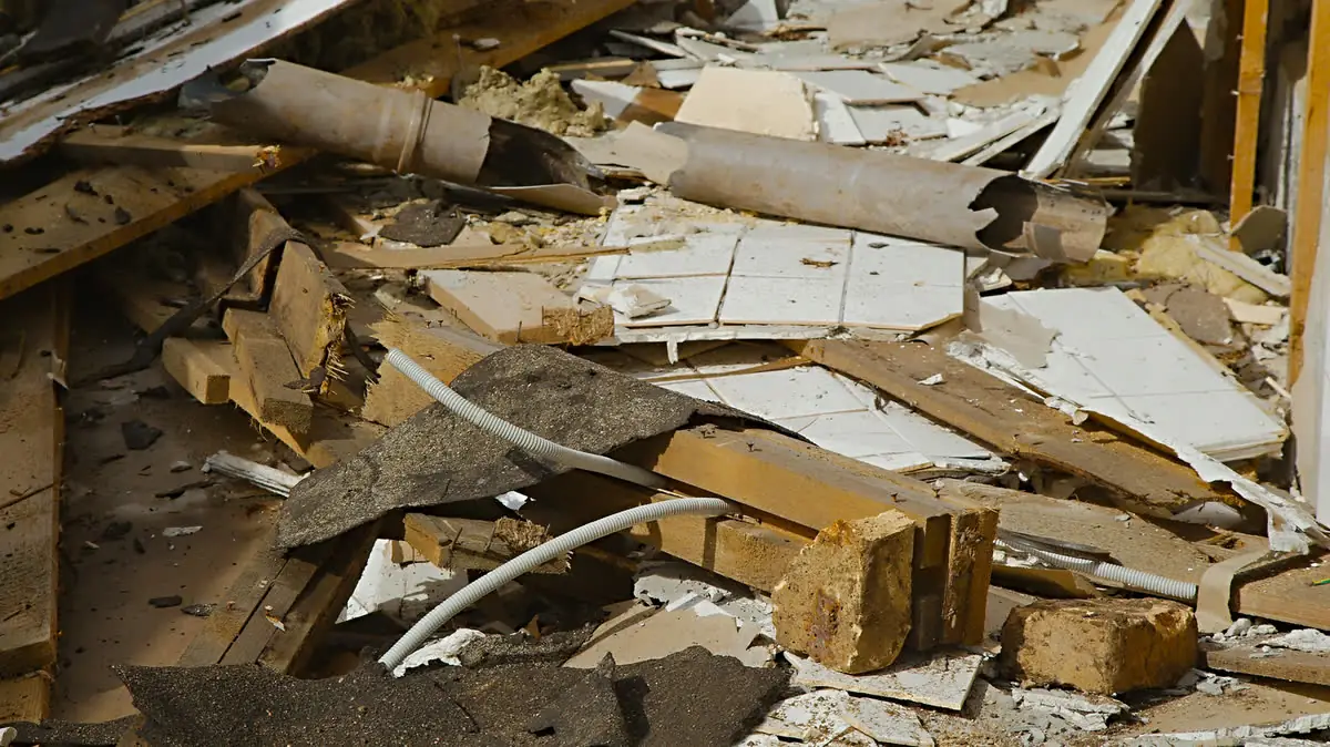 Torn-out wood and debris from a renovation, ready to haul.